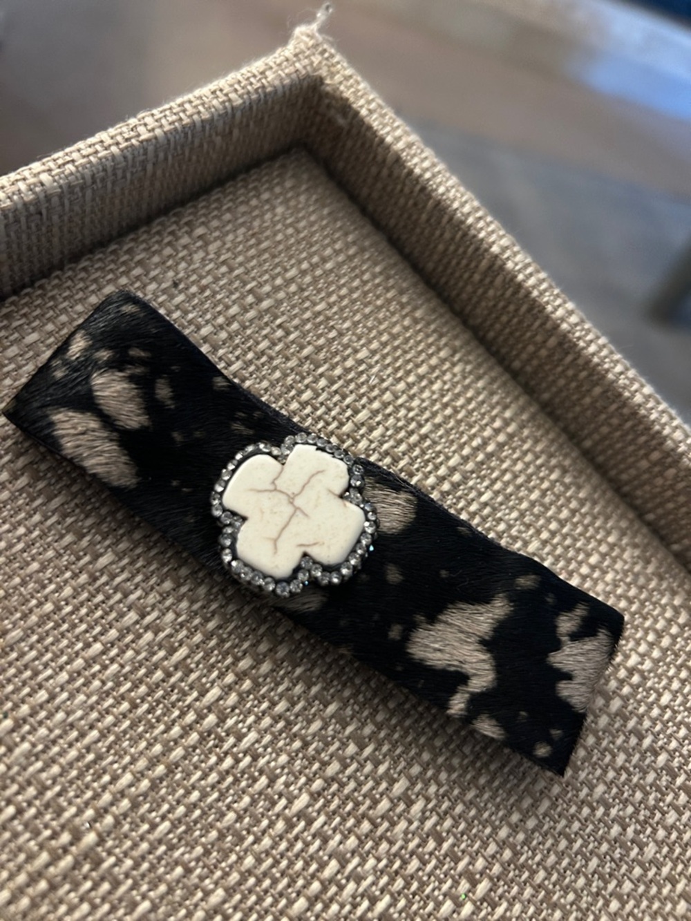 Women's Black and Cream faux Cowhide Bracelet with Ivory Cross Accent